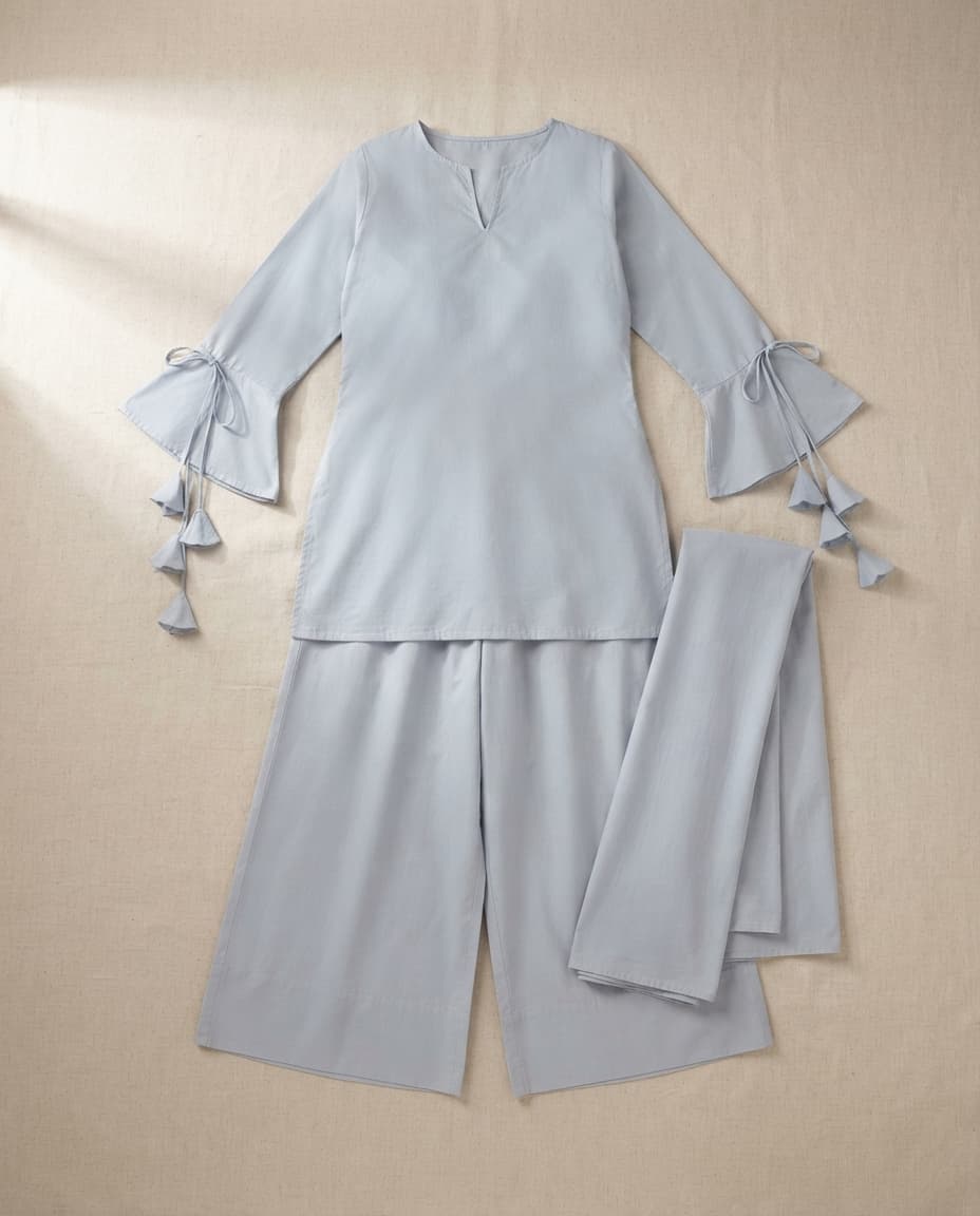 Styled Flat Lay photography style: The garment laid flat and shot from above, no model.